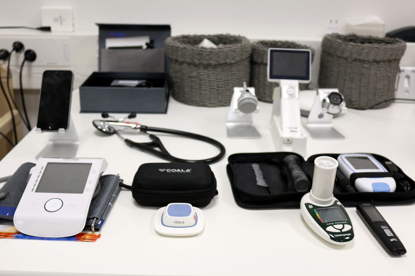 A variety of health and medical monitoring devices on the table.