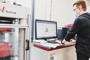 A person uses a device in the Construction Technology Laboratory.