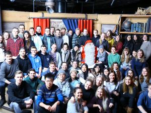 A group of students meeting Santa Claus in the Santa Claus Village in Lapland.