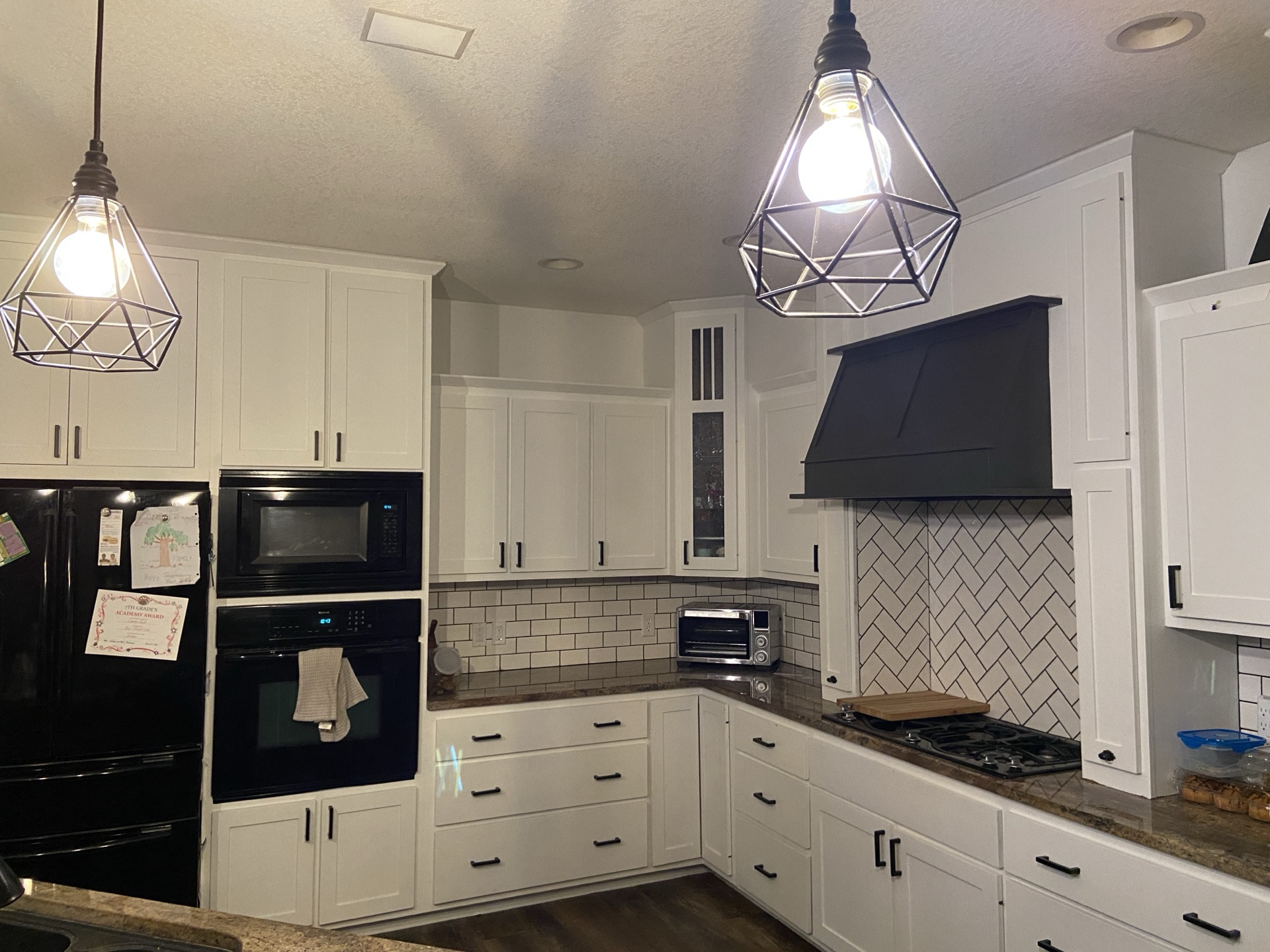 Custom kitchen with herringbone backsplash by Seeger & Co