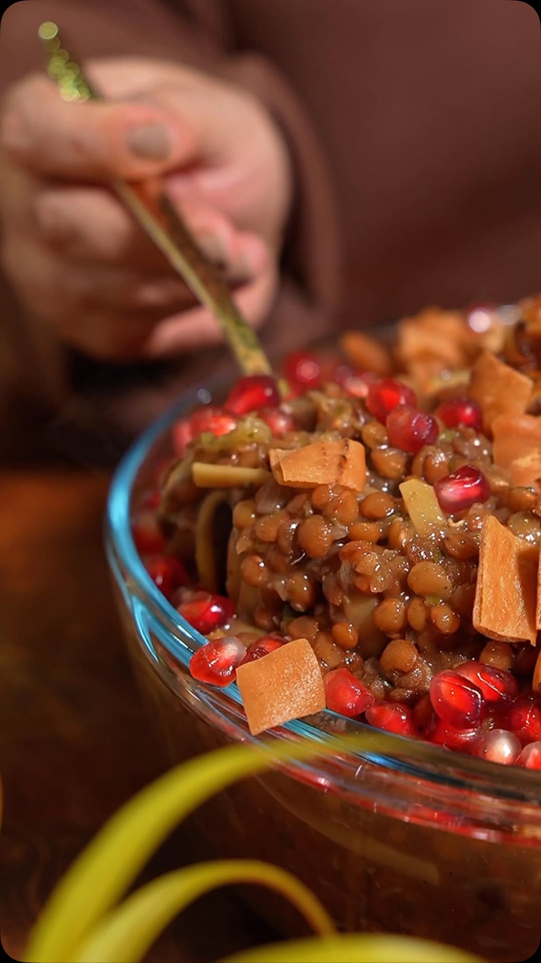 Harak Osbao (Lentils and Pasta with Pomegranate and Fried Bread)