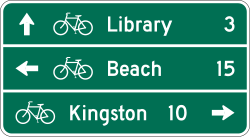 Three line bicycle destination guide sign with distance