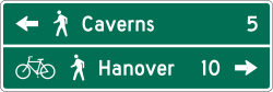 Two line shared-use path destination and distance guide sign