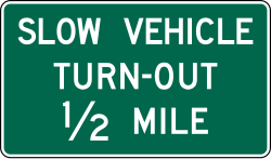 Slow vehicle turn-out at specified distance ahead