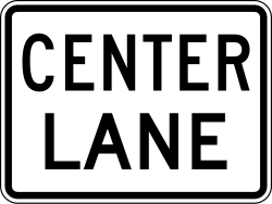 Lane designation plaque for center lane