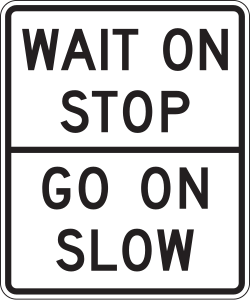 Combined sign instructing to wait on stop and proceed slowly when indicated