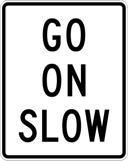 Instructs drivers to proceed slowly when the indication is displayed