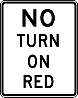 Prohibits turns during red signal phase