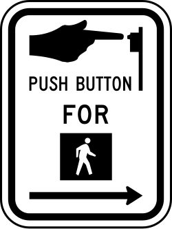 Location to push button to activate pedestrian crossing signal