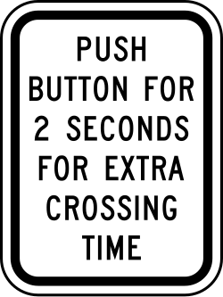 Instructions to push button for 2 seconds to get extra crossing time