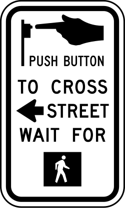Instructions to push button and wait for pedestrian signal before crossing