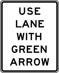 Instructs drivers to use only the lane with the green arrow signal