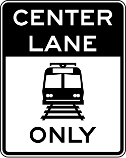 Restricts the center lane to light rail vehicles only