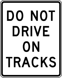 Alternative design prohibiting vehicles from driving on railroad tracks