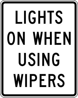 Requires headlights to be turned on when windshield wipers are in use