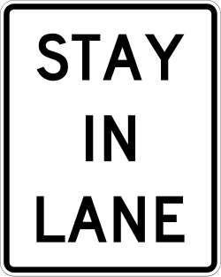 Requires vehicles to remain in their designated lane