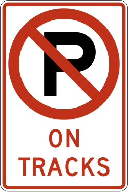 Prohibits parking on or blocking railroad tracks