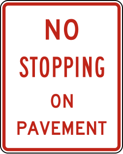 Prohibits stopping on the paved roadway surface