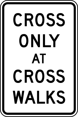 Requires pedestrians to cross only at designated crosswalks
