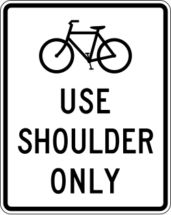 Requires bicycles to use only the road shoulder area
