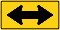 Large arrow indicating two-way traffic flow or alignment