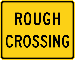 Supplemental plaque warning of rough railroad crossing