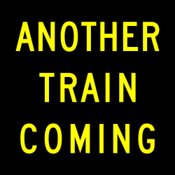Activated blank-out sign warning of another train approaching