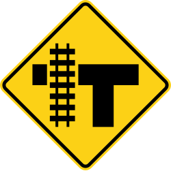 T intersection with railroad tracks parallel to the left
