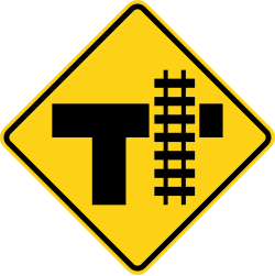 T intersection with railroad tracks parallel to the right