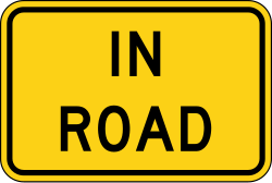 Supplemental plaque indicating 'In Road' for warning signs