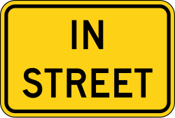 Supplemental plaque indicating 'In Street' for warning signs