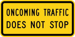 Supplemental plaque indicating oncoming traffic does not stop