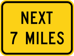 Supplemental plaque indicating the distance to the next hill condition