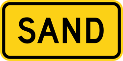 Supplemental plaque indicating sand surface for truck ramp