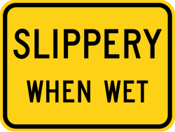 Supplemental plaque for slippery when wet conditions