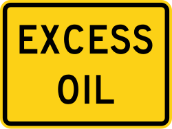 Supplemental plaque indicating excess oil on road surface