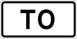 To plaque indicating direction to a route