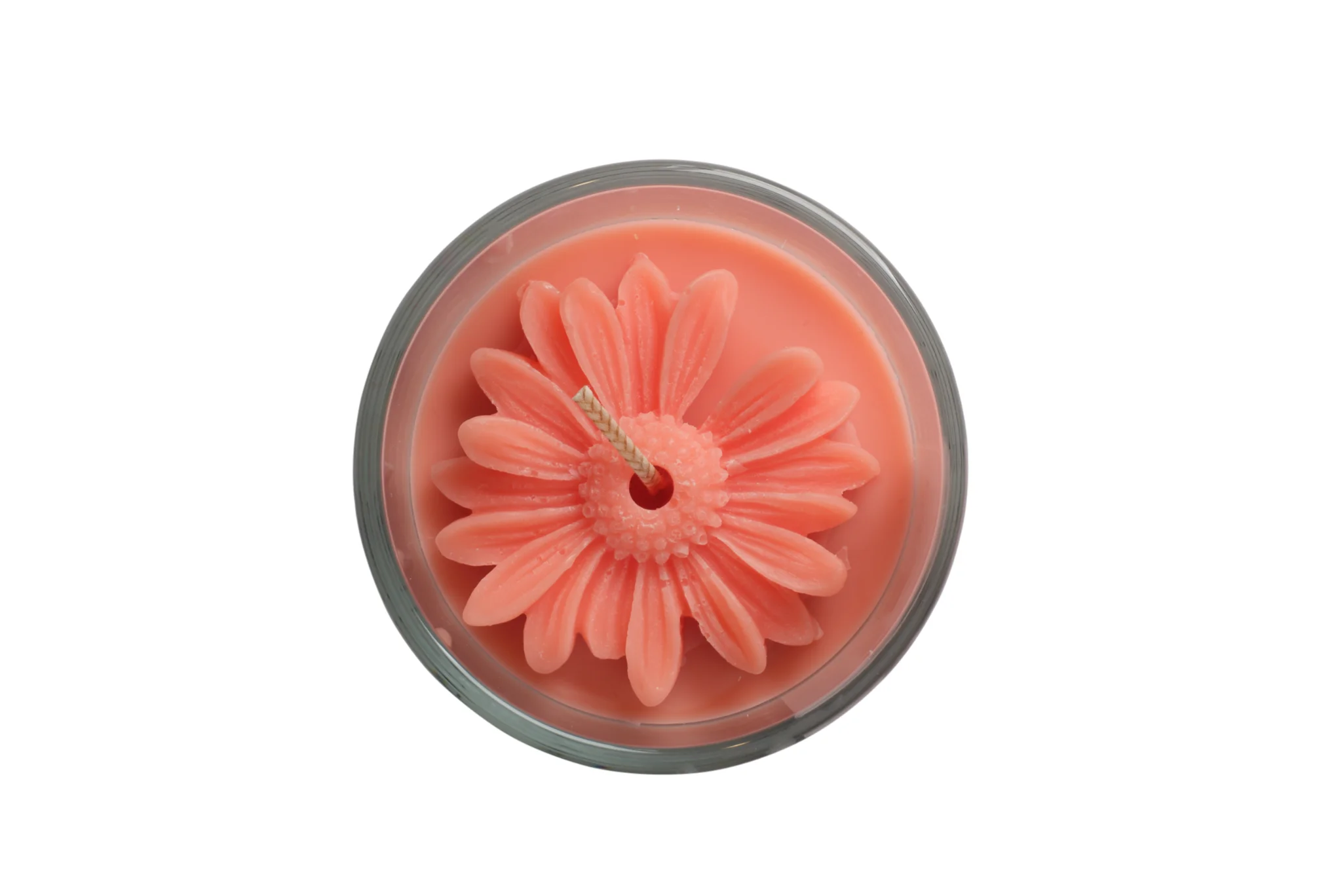 A minimalist scented candle in a ceramic jar with a perfectly even, melted wax pool and a steady golden flame, styled on a clean stone surface with a soft-focus background.
