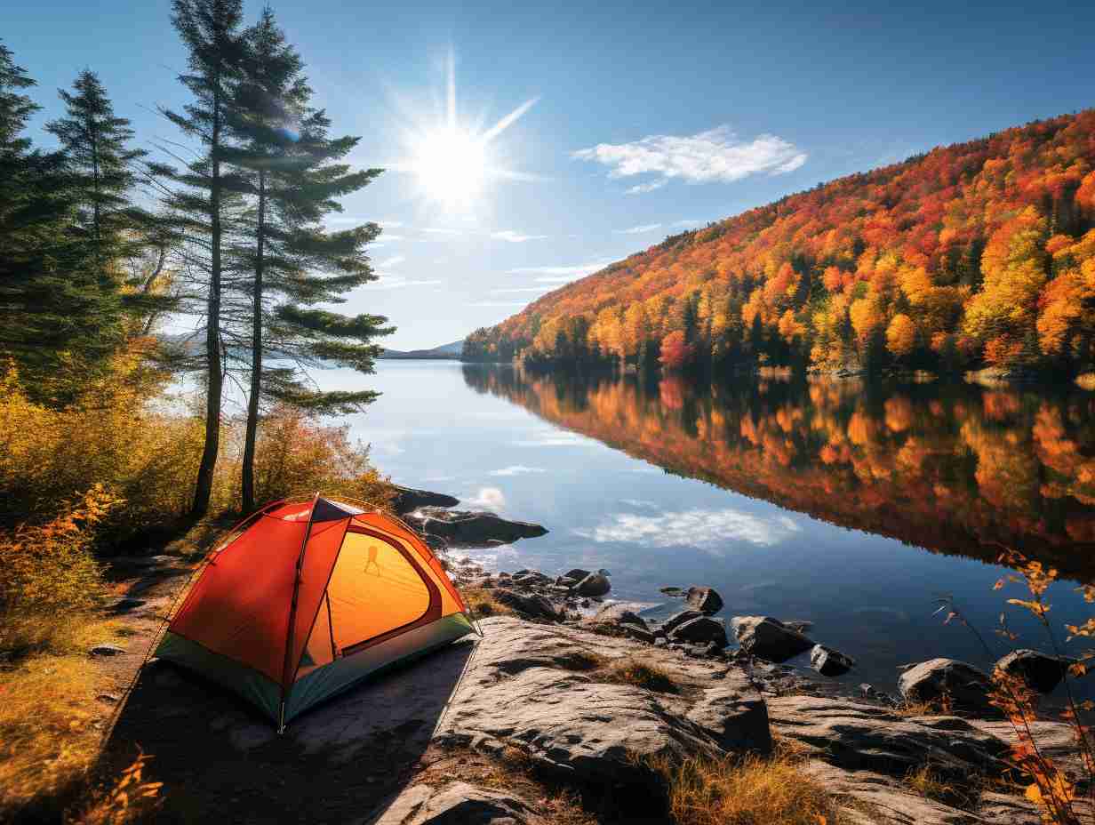 A tent nestled amidst vibrant autumn foliage near a serene lake in Quebecs wilderness