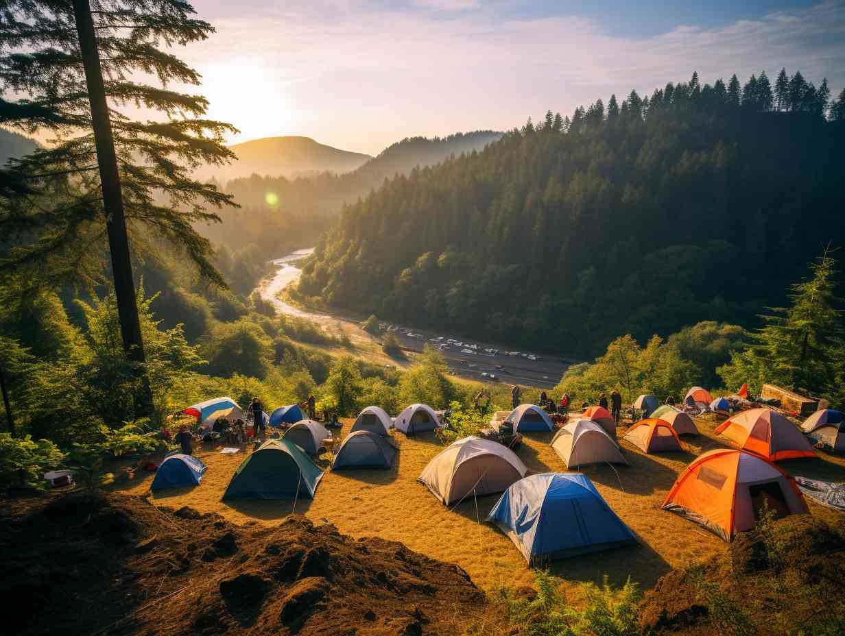 A stunning view of a lush green gorge with colorful tents scattered across the landscape surrounded by towering trees.