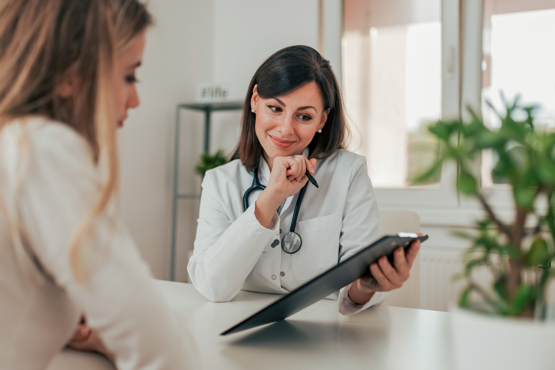 doctor showing results to patient