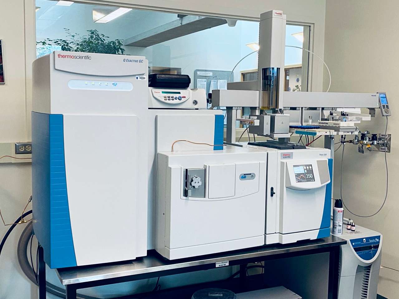 A high-precision mass spectrometry machine in a clean, modern laboratory setting, representing the equipment used for peptide purity and identity verification.