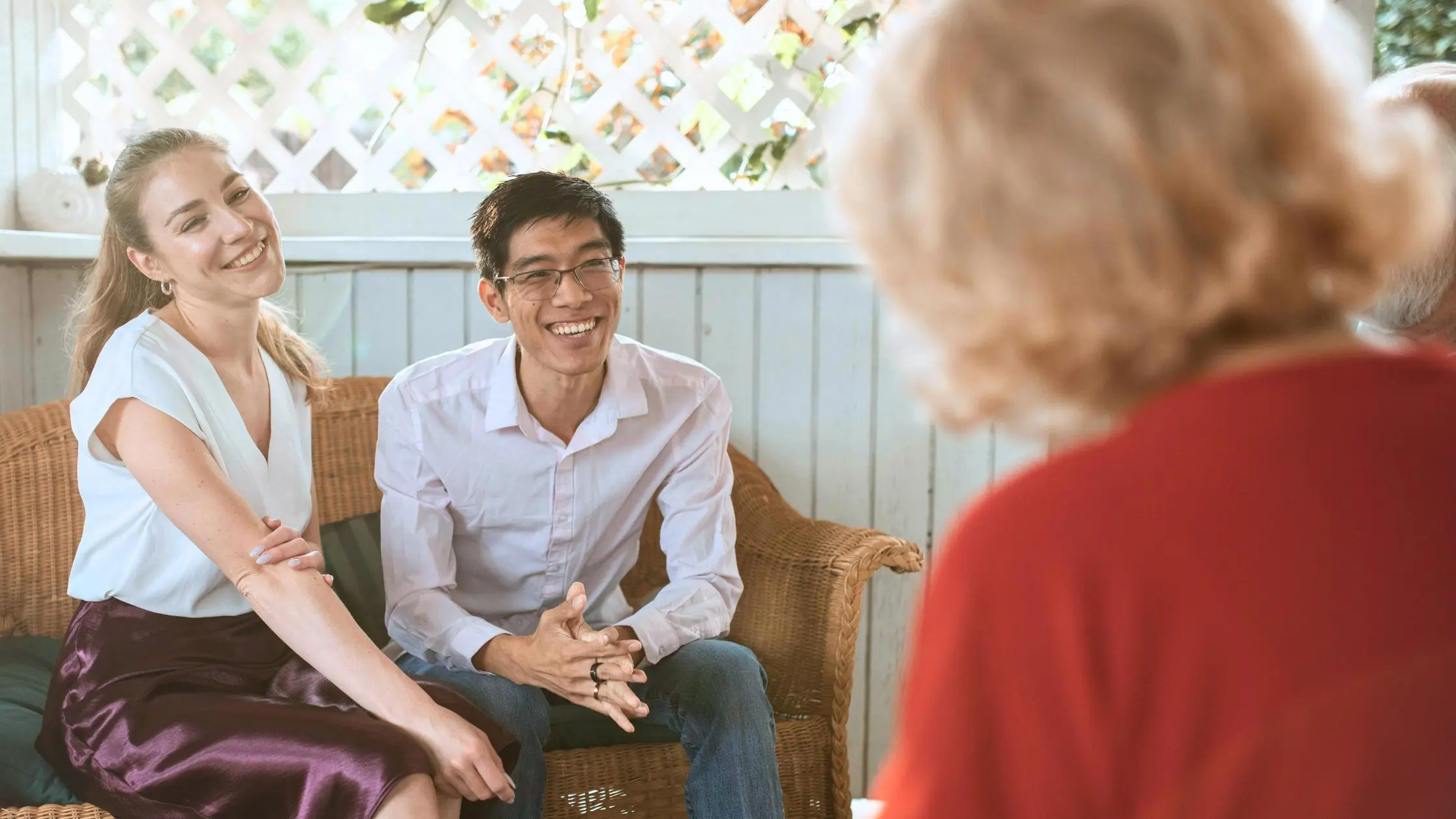 A couple talking to the parents of the woman
