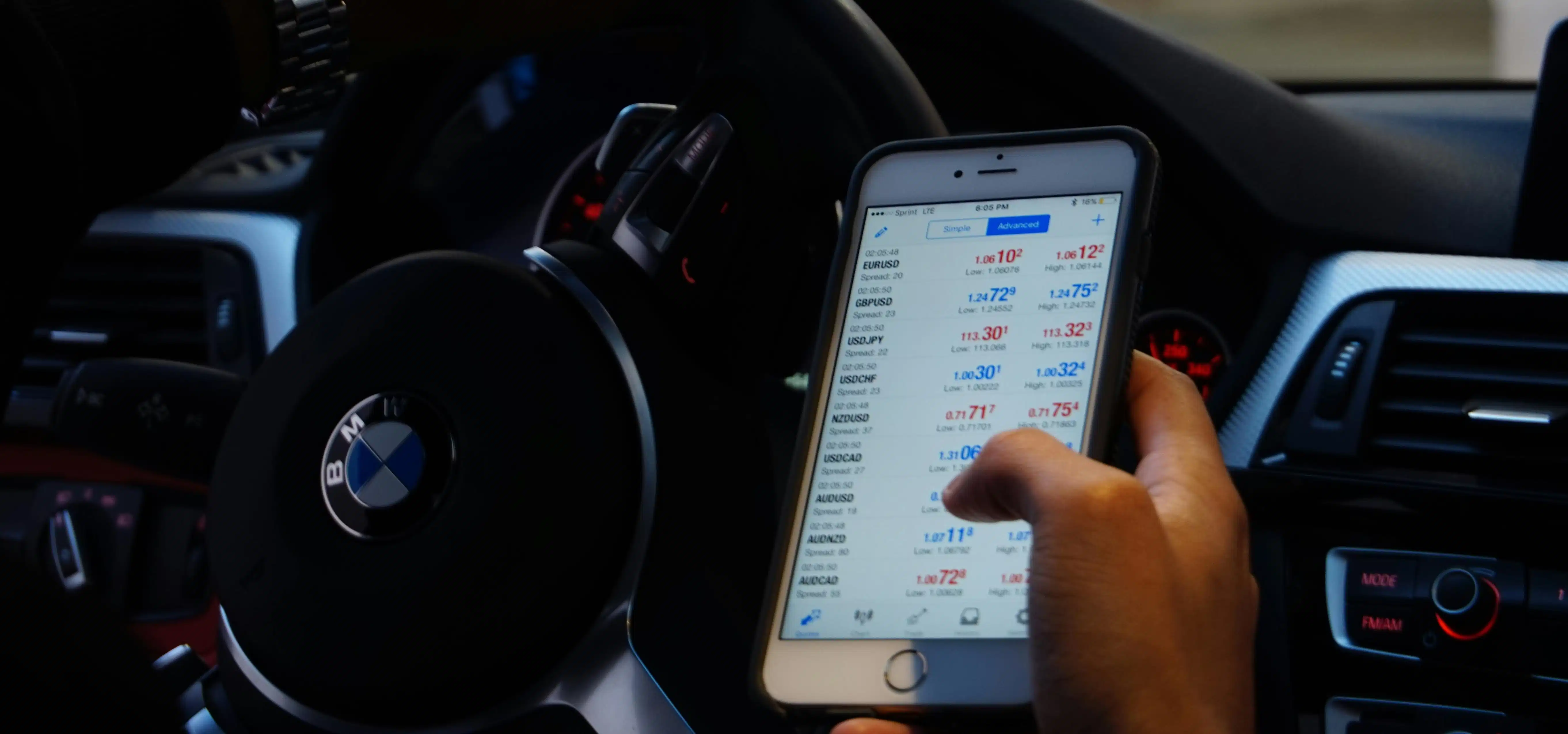 Someone scrolling through a phone that displays cryptocurrency