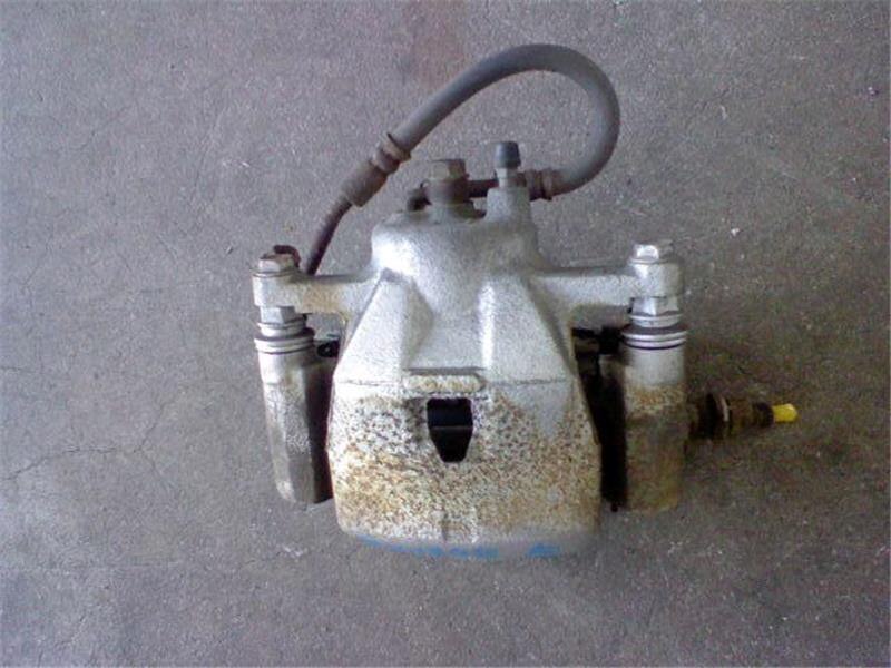 Front Left Brake Caliper TOYOTA Vitz 2007 DBA-SCP90 — photo 1
