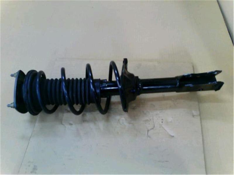 Front Left Strut Assembly TOYOTA Vitz 1999 GF-SCP10 — photo 1