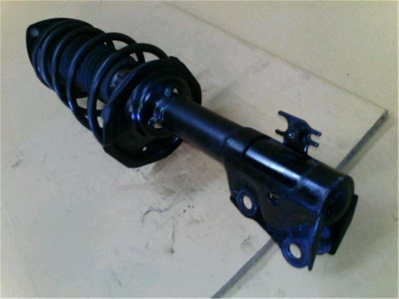Front Left Strut Assembly TOYOTA Vitz 1999 GF-SCP10 — photo 4