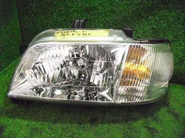 Left Headlight NISSAN Cube 1999 GF-Z10 — photo 1