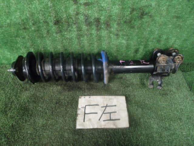 Front Left Strut Assembly NISSAN Cube 2001 TA-ANZ10 — photo 1