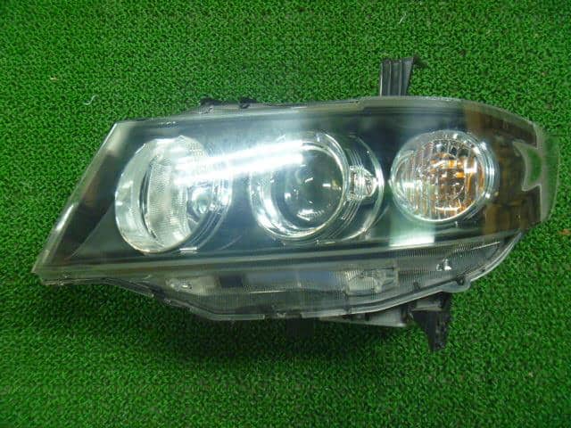 Left Headlight HONDA Zest 2009 DBA-JE1 — photo 1